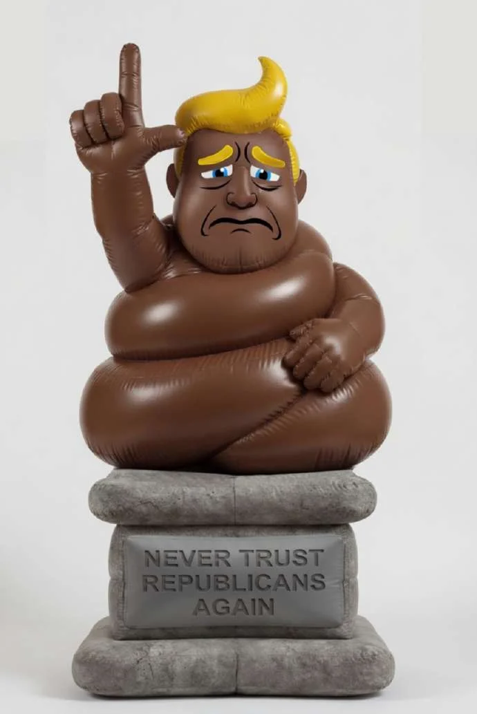 Inflatable turd-Trump figure on a stone pedestal reading 'Never Trust Republicans Again'