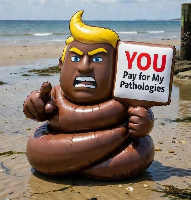 Inflatable turd-Trump on a beach holding sign: 'YOU Pay for My Pathologies'