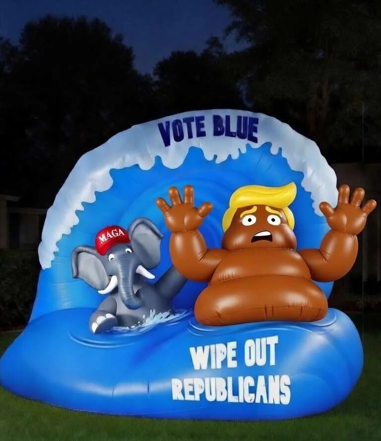 Inflatable blue wave with 'Vote Blue' text washing over turd-Trump and a MAGA-hat elephant; text 'Wipe Out Republicans'