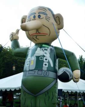 John Lawler's prior inflatable political creation: a giant Bushocchio (Bush + Pinocchio) at an outdoor event